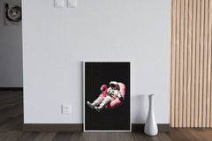 Spaceman floating free in space on a pink Inflatable Flamingo Ride-On - beink online art store