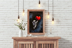 Astronaut in the space holding a big red heart wall art