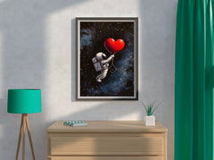 Astronaut in the space holding a big red heart wall art