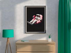 Spaceman floating free in space on a pink Inflatable Flamingo Ride-On - beink online art store